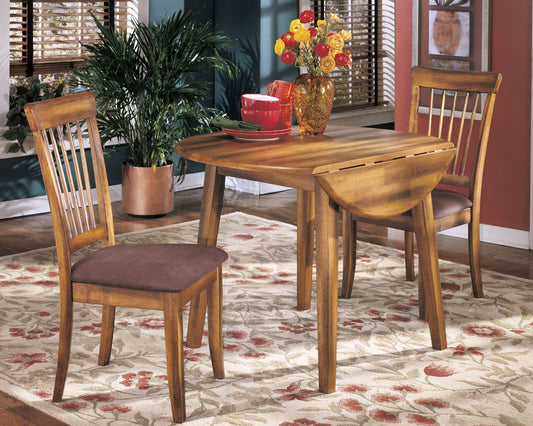 Ashley Express - Berringer Round DRM Drop Leaf Table at Towne & Country Furniture (AL) furniture, home furniture, home decor, sofa, bedding