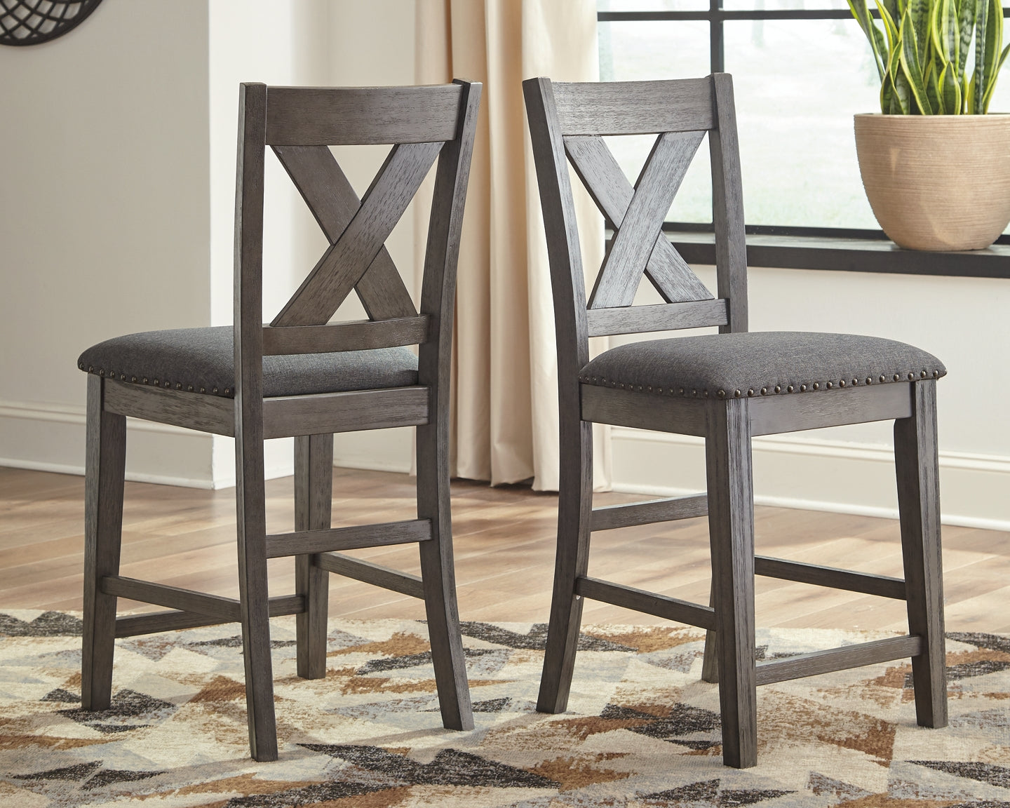 Ashley Express - Caitbrook Counter Height Upholstered Bar Stool (Set of 2) at Towne & Country Furniture (AL) furniture, home furniture, home decor, sofa, bedding