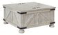 Ashley Express - Carynhurst Coffee Table with 2 End Tables at Towne & Country Furniture (AL) furniture, home furniture, home decor, sofa, bedding