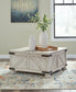 Ashley Express - Carynhurst Coffee Table with 2 End Tables at Towne & Country Furniture (AL) furniture, home furniture, home decor, sofa, bedding