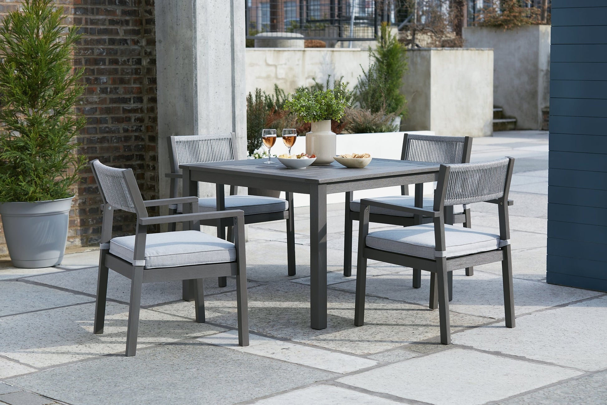 Ashley Express - Eden Town Outdoor Dining Table and 4 Chairs at Towne & Country Furniture (AL) furniture, home furniture, home decor, sofa, bedding
