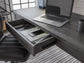 Ashley Express - Freedan Home Office Desk at Towne & Country Furniture (AL) furniture, home furniture, home decor, sofa, bedding