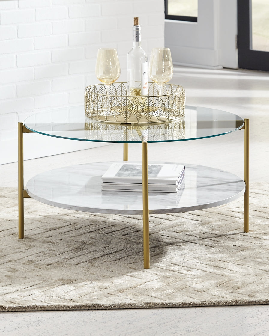 Ashley Express - Wynora Round Cocktail Table at Towne & Country Furniture (AL) furniture, home furniture, home decor, sofa, bedding