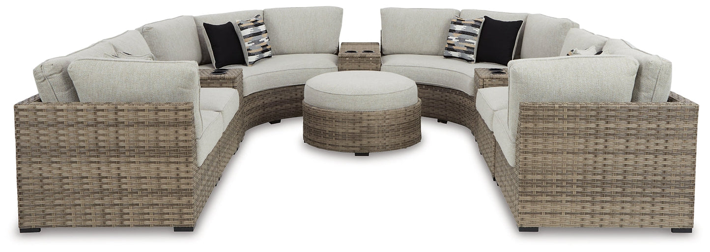 Calworth Outdoor 9-Piece Sectional with Ottoman at Towne & Country Furniture (AL) furniture, home furniture, home decor, sofa, bedding