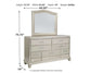Coralayne California King Upholstered Bed with Mirrored Dresser at Towne & Country Furniture (AL) furniture, home furniture, home decor, sofa, bedding