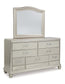 Coralayne King Upholstered Bed with Mirrored Dresser and Chest at Towne & Country Furniture (AL) furniture, home furniture, home decor, sofa, bedding