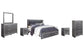 Lodanna King Panel Bed with 2 Storage Drawers with Mirrored Dresser, Chest and 2 Nightstands at Towne & Country Furniture (AL) furniture, home furniture, home decor, sofa, bedding